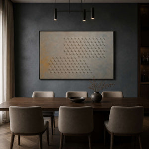 Relief circle artwork displayed in a deep blue-gray dining room.