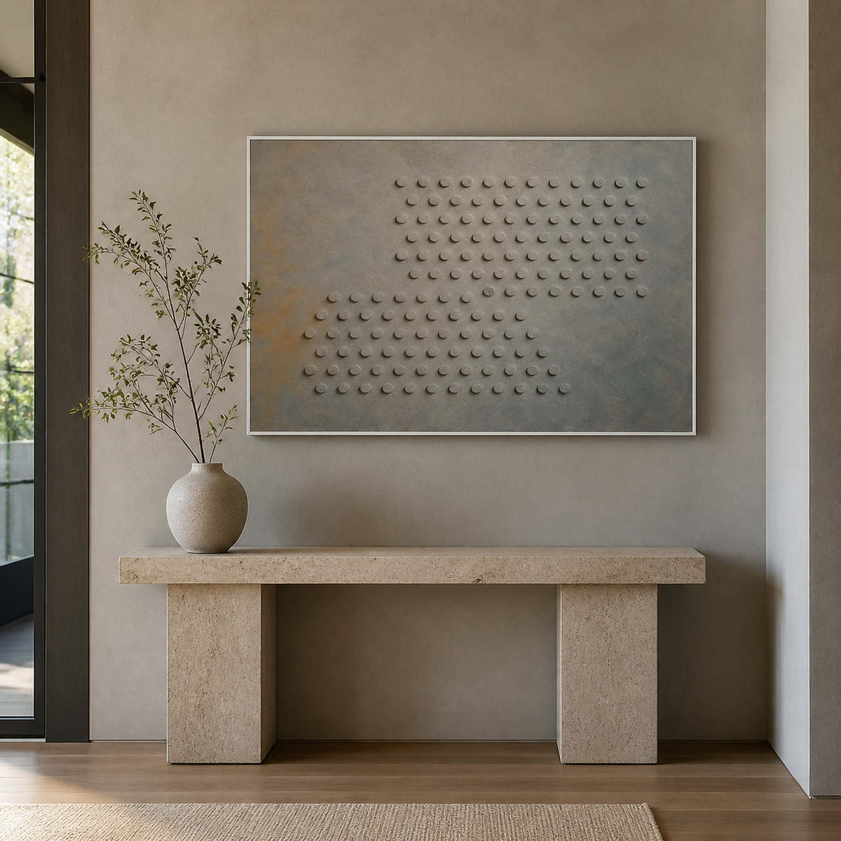 Textured abstract wall art displayed above a stone entryway console.