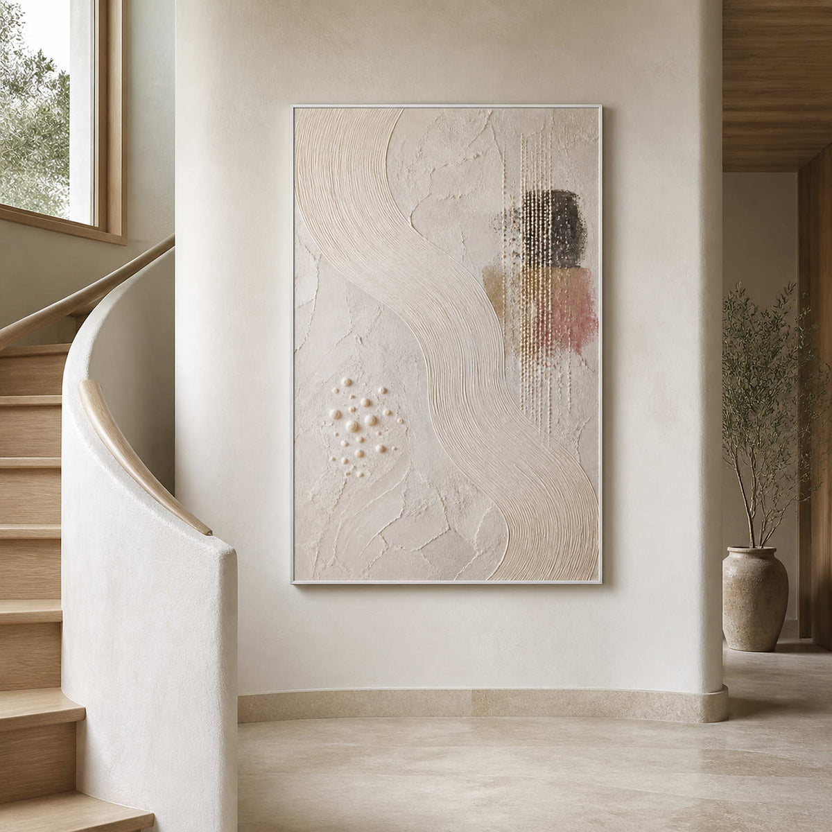 Vertical textured wall art displayed beside a warm white stairway.