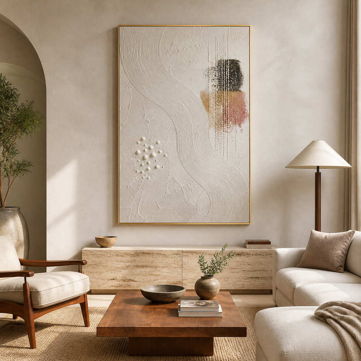 Textured minimalist wall art displayed in a warm travertine living room.