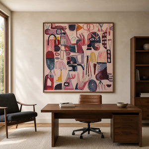Wood framed playful abstract painting above a leather desk chair in a home office.
