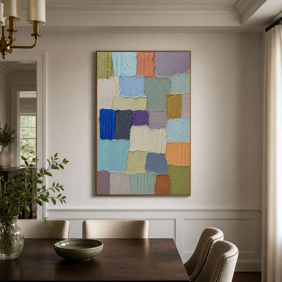 Pastel textured abstract artwork adds quiet color to an elegant dining room.