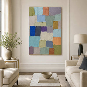 Soft multicolor textured abstract wall art in a bright neutral living room.