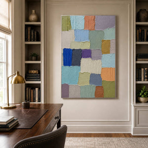 Vertical textured abstract painting brings balanced color to a refined office.