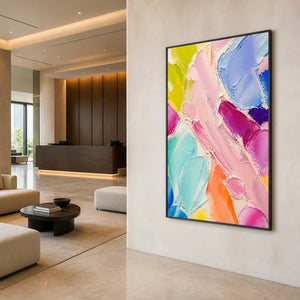 Vibrant vertical abstract wall art displayed in a contemporary hotel lobby.