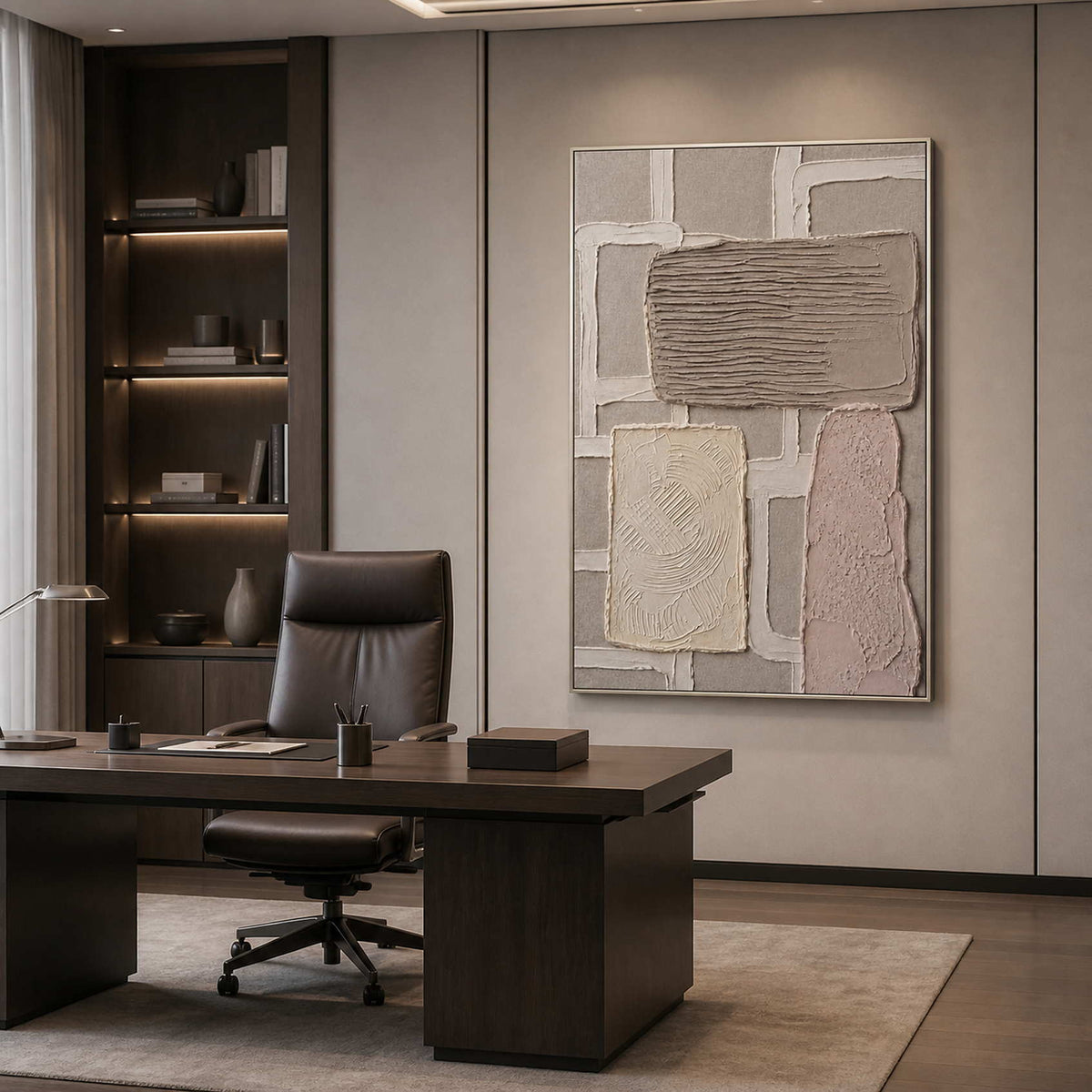 Vertical neutral artwork in a silver frame displayed in a modern office.