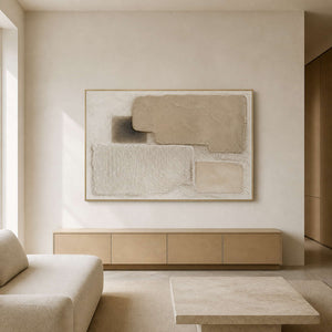 Textured neutral wall art displayed in a warm white oak living room.