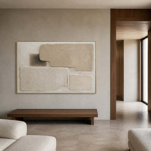 Textured minimalist painting displayed in a warm gray open lounge.