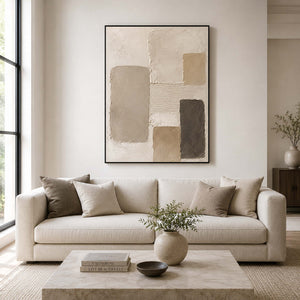 Warm neutral abstract wall art styled in a living room.