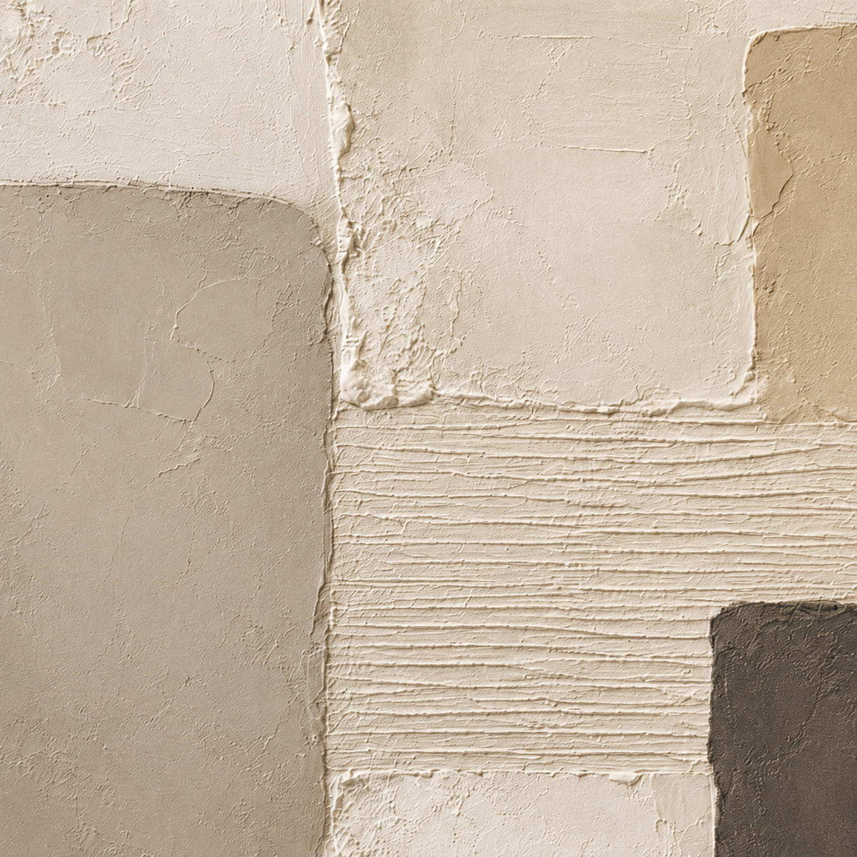 Close-up of soft plaster texture and neutral blocks.