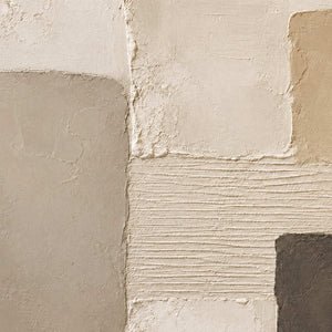 Close-up of soft plaster texture and neutral blocks.