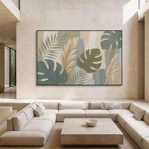 Sage leaves and ivory pampas grasses wall art in a contemporary living room.