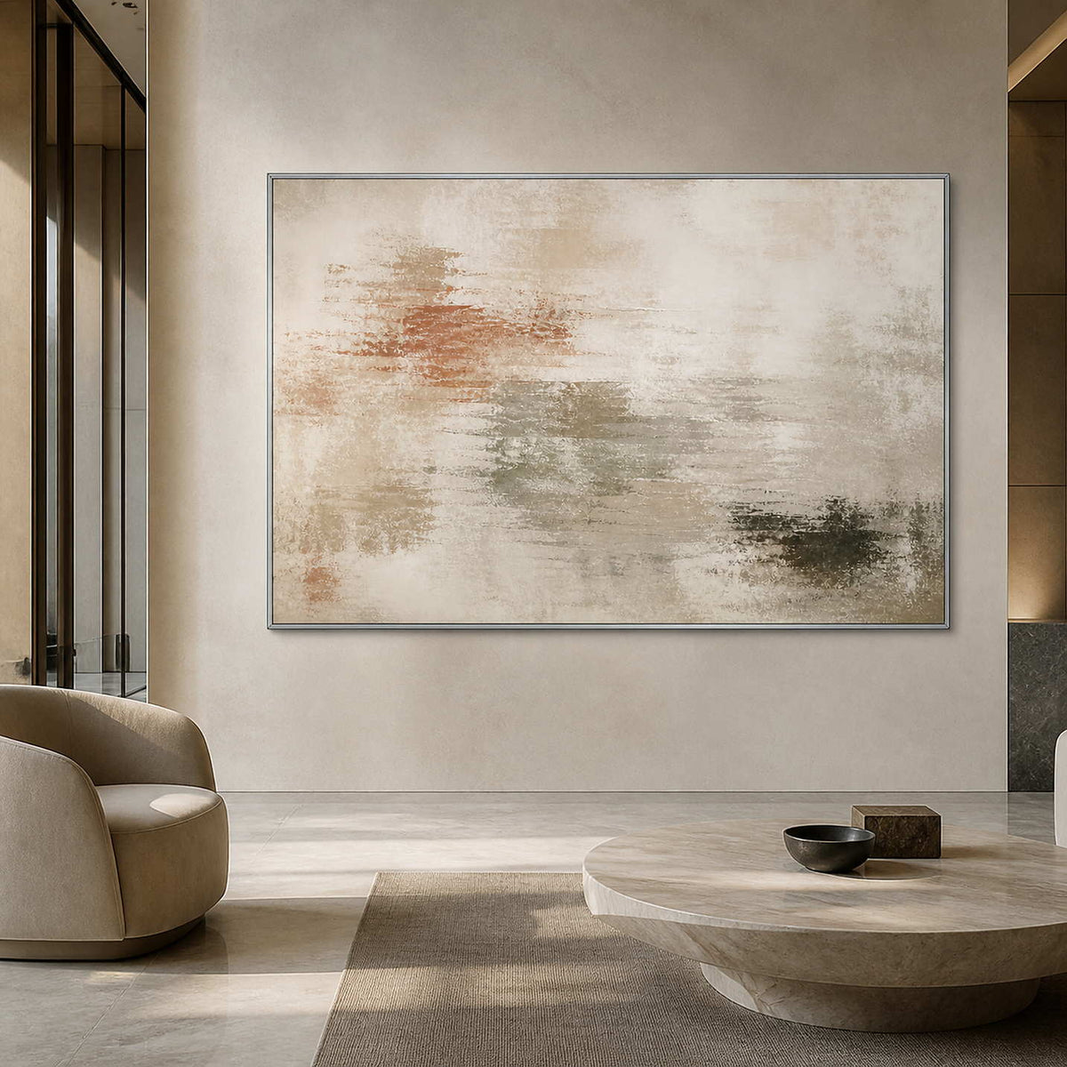 Airy neutral artwork in a silver frame inside a serene modern lobby.