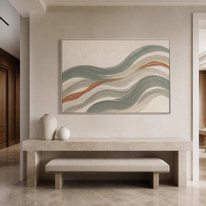 Sage coastal wall art displayed above a minimalist entryway bench.