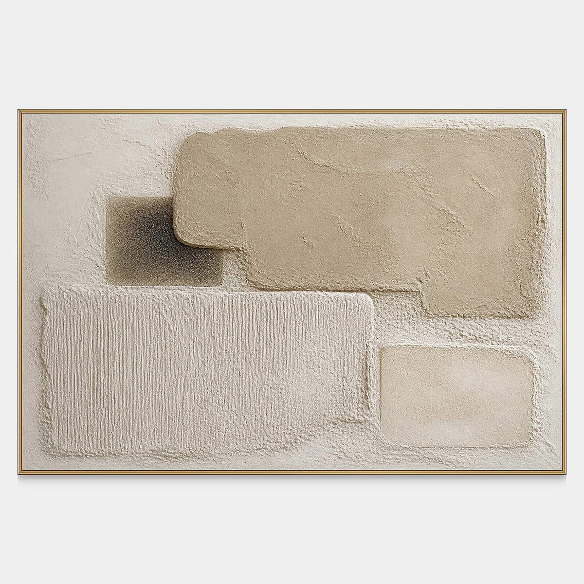 Four rounded relief blocks in sand, ivory, taupe, and charcoal gray.