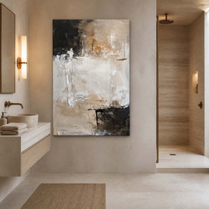 Frameless beige abstract canvas hanging beside a bathroom vanity and stone basin.