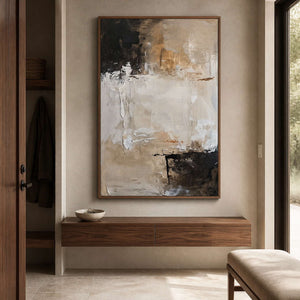 Wood framed beige and black abstract painting displayed in an entryway.