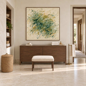 Spring Comes Calling in a wood frame above a cabinet with folded towels in a neutral bathroom dry area.