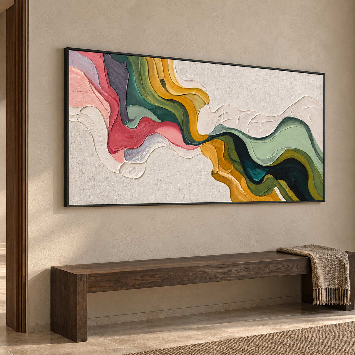 Wide green and pink abstract over a dark wooden bench with a draped throw.