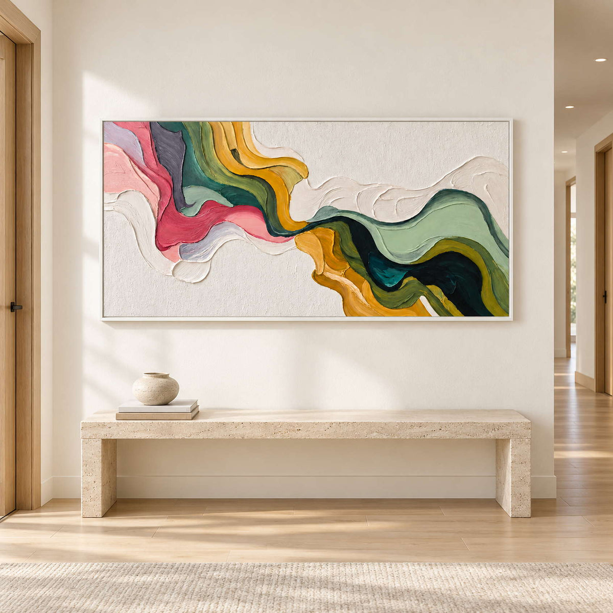 White-ground flowing abstract above a long pale bench in a bright hallway.