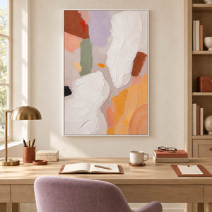 Abstract painting with ivory, lilac, sage, terracotta, and ochre forms in a white frame in a home office.