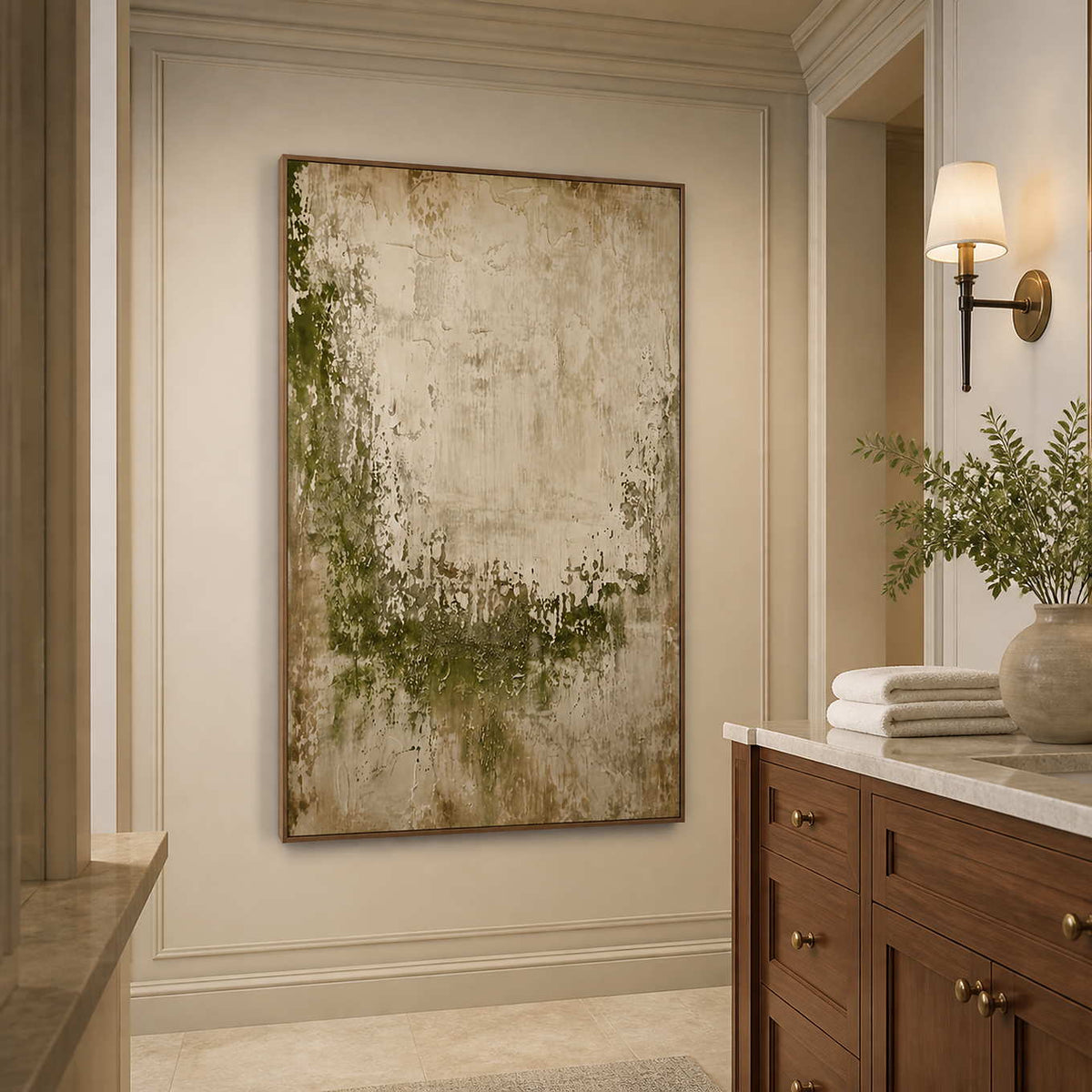Wood framed textured green artwork beside a stone vanity in a neutral bathroom.