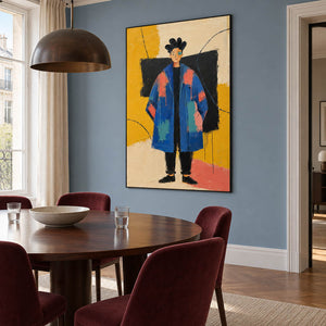 Hand-painted modern portrait of a cobalt-coated figure against coral, mustard, cream, and black, displayed in a dining room in a black frame.