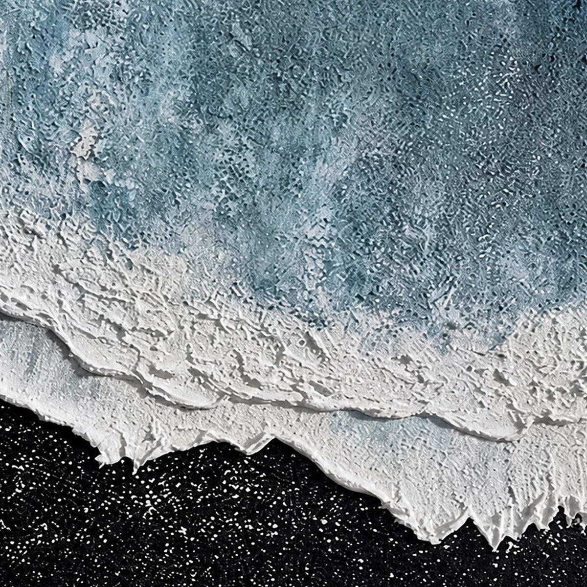 Detailed pale blue textured surface with raised white ridges above speckled black.