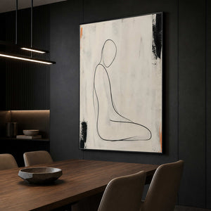 Ivory line figure painting displayed in a dark dining room.