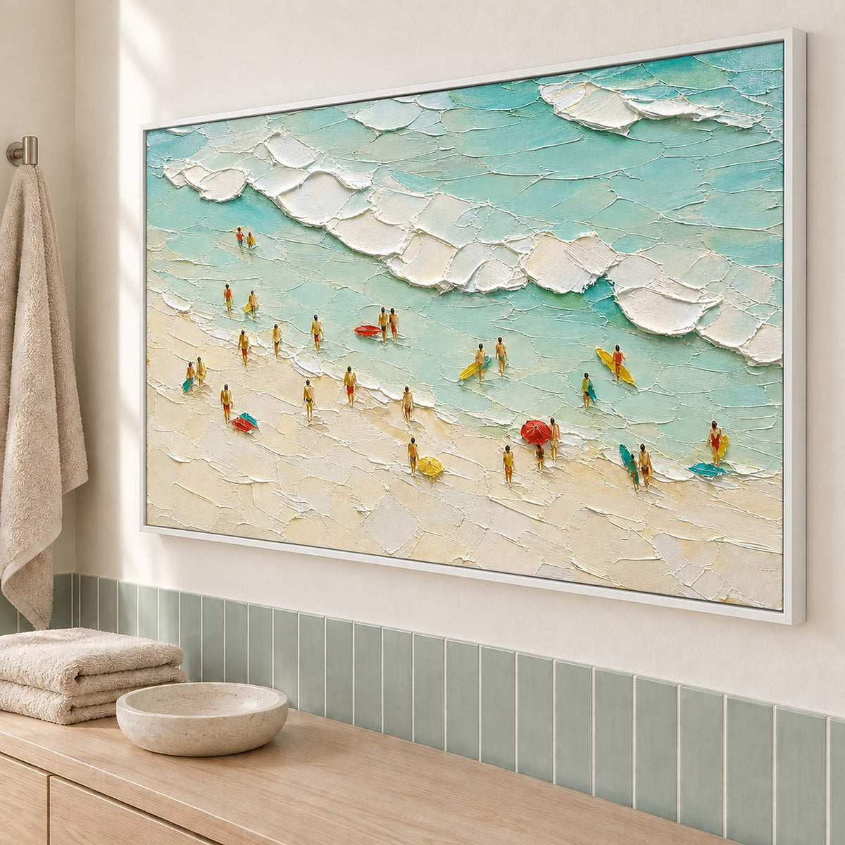 Textured beach painting with sea-glass waves and small beachgoers in a white frame beside a bathroom vanity.