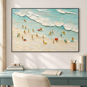 Textured beach painting with sea-glass waves and small beachgoers in a black frame in a home office.