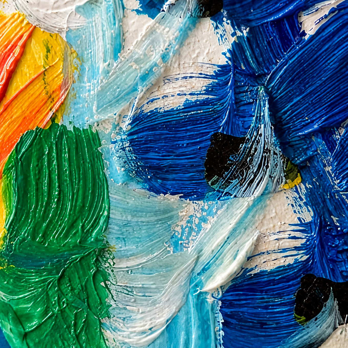 Close view of raised blue, green, white, and orange brush ridges crossing the floral surface.