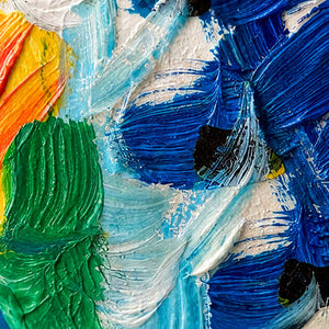 Close view of raised blue, green, white, and orange brush ridges crossing the floral surface.