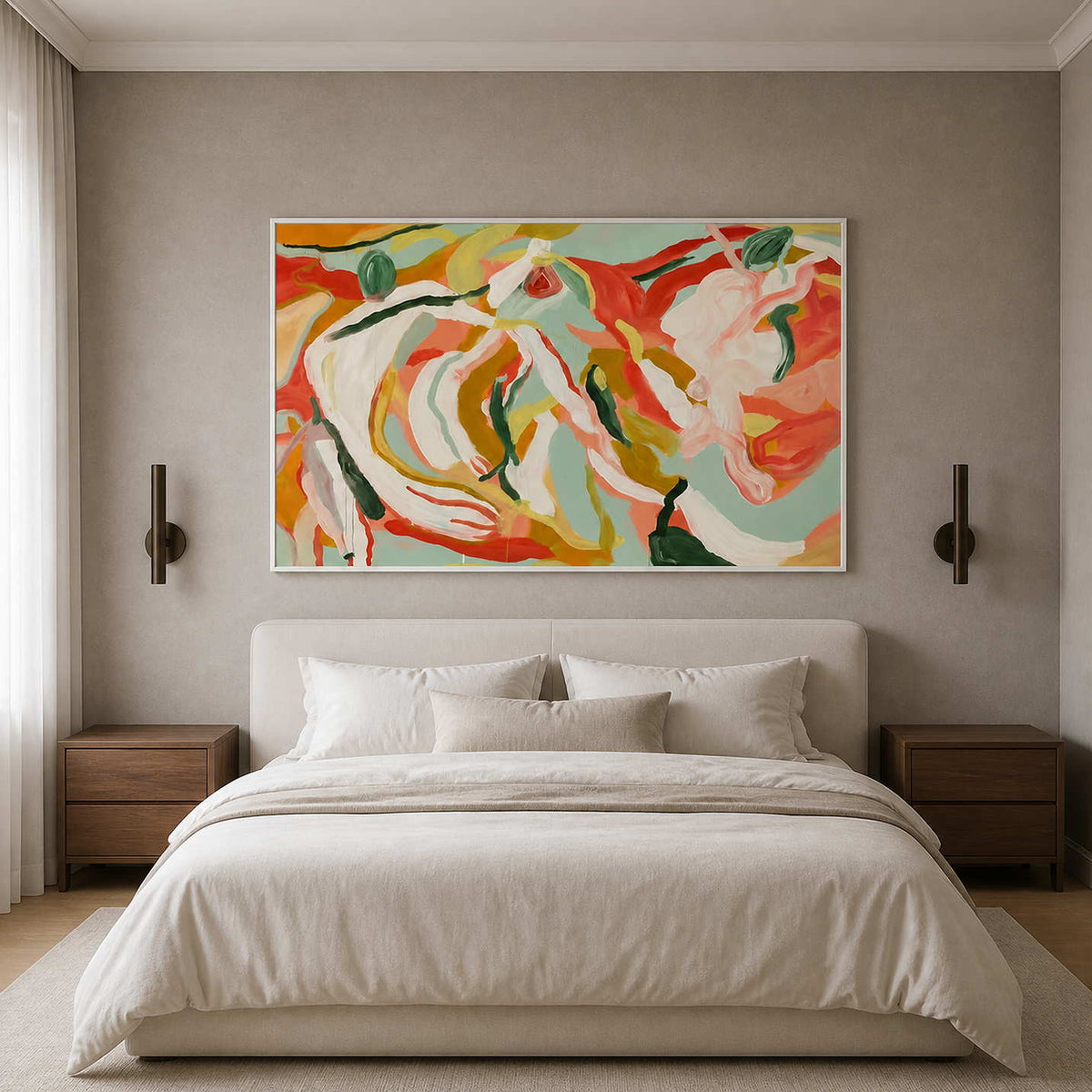 White-framed colorful floral artwork above a cream bed between two slim wall lights.