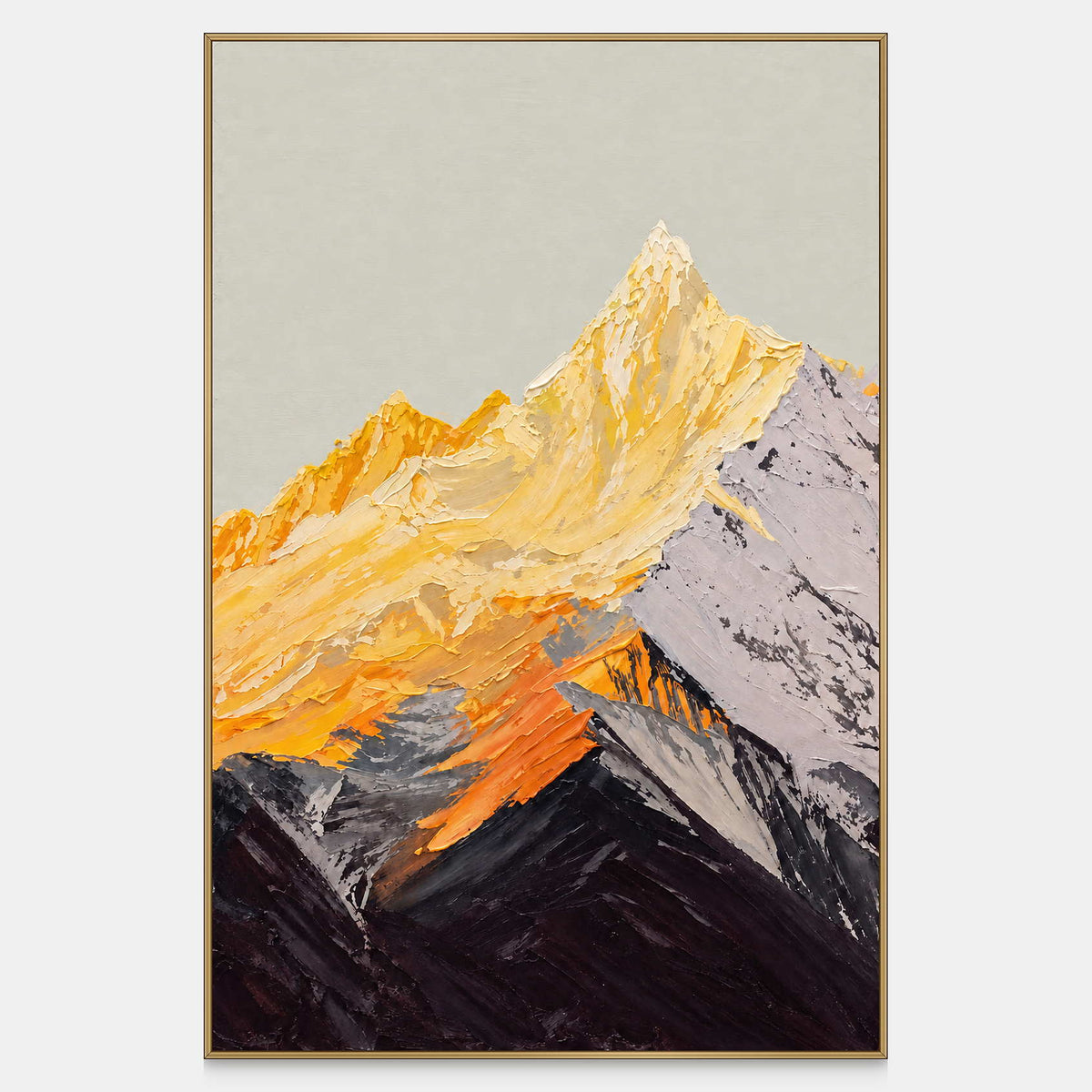 Vertical mountain artwork with golden-yellow peaks, a gray right slope and dark overlapping ridges beneath a pale sky, shown in a slim gold-colored frame.