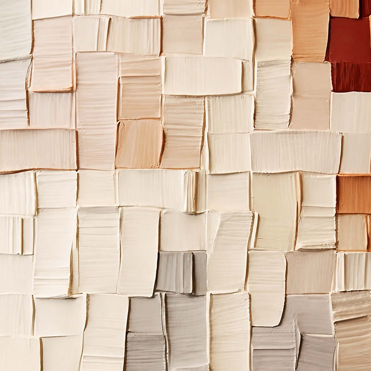 Close-up of raised cream and peach rectangles with uneven edges, gray shadows, and rust accents.