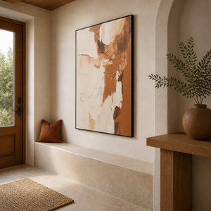 Black framed textured artwork above a stone entryway bench beside a wooden door.
