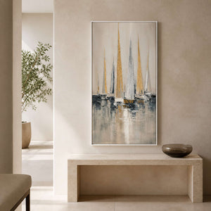 Vertical sailboat wall art displayed above a pale stone entryway console.