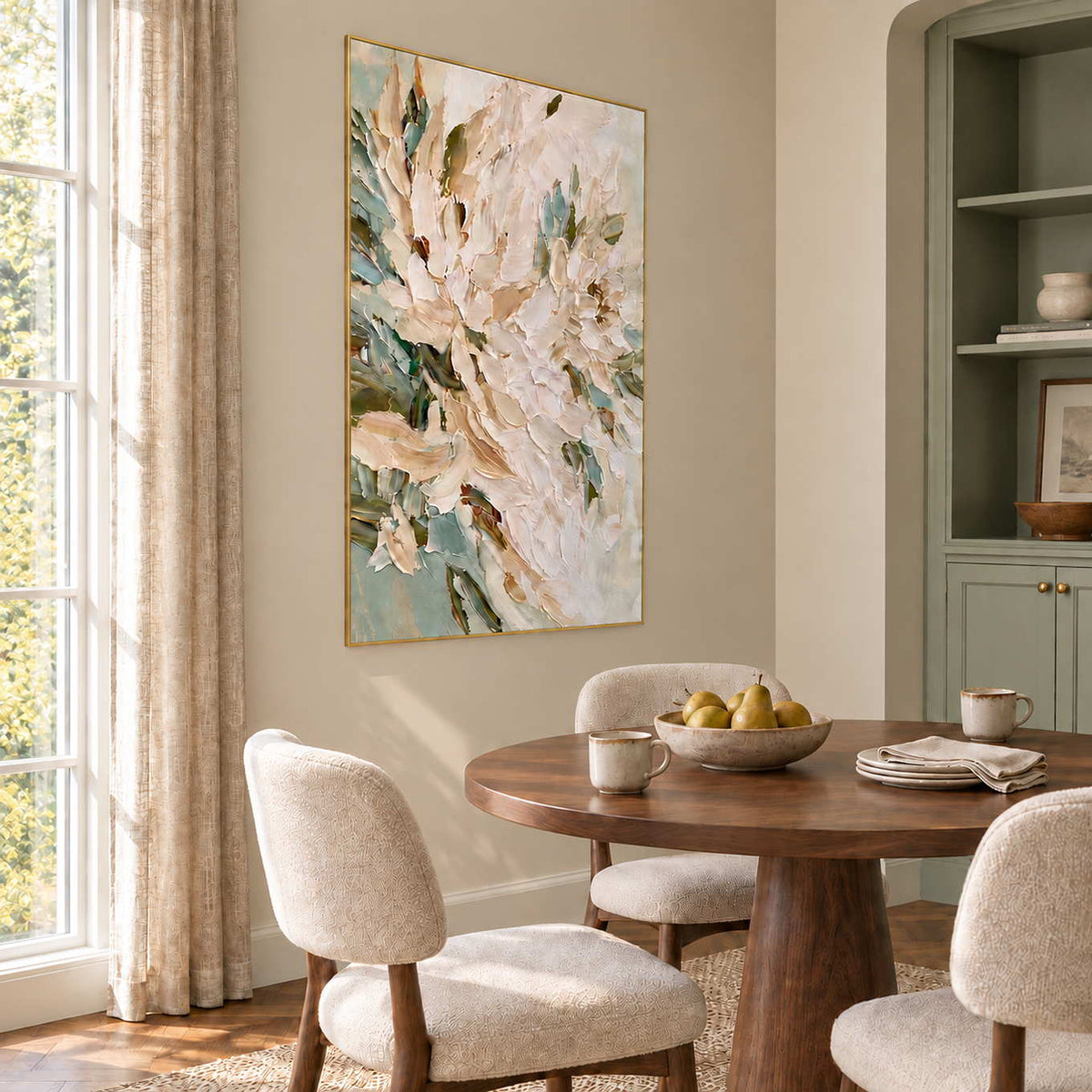 Tenderly in Bloom in a gold frame beside a round wood dining table with cream upholstered chairs.