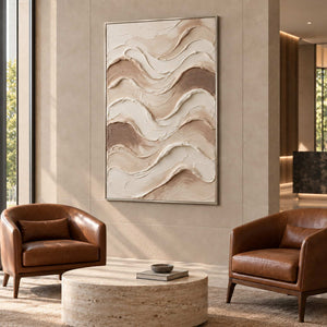 Tenderness in a silver frame above two brown leather armchairs and a round stone table in a commercial lobby.