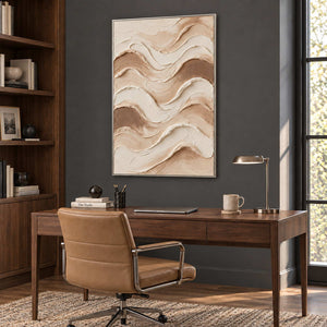 Tenderness in a silver frame above a wood desk and tan leather chair against a charcoal wall.