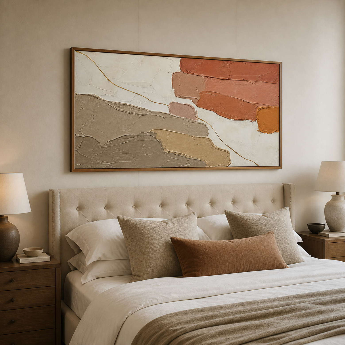 Warm textured abstract wall art styled above a neutral bed.