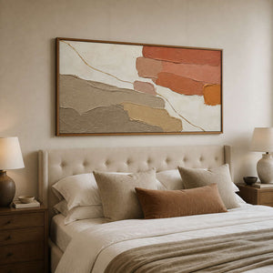 Warm textured abstract wall art styled above a neutral bed.