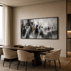 Monochrome figurative wall art in a dining room with a black frame.