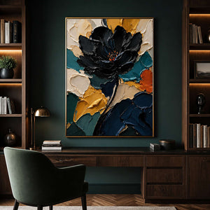 Dramatic black flower wall art displayed in a dark green home office.