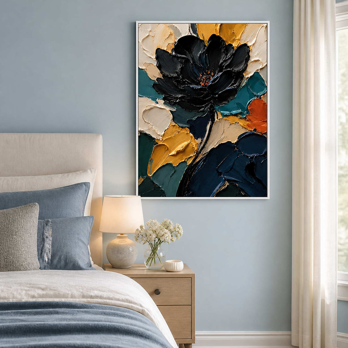 Black and teal floral wall art displayed in a mist-blue bedroom.
