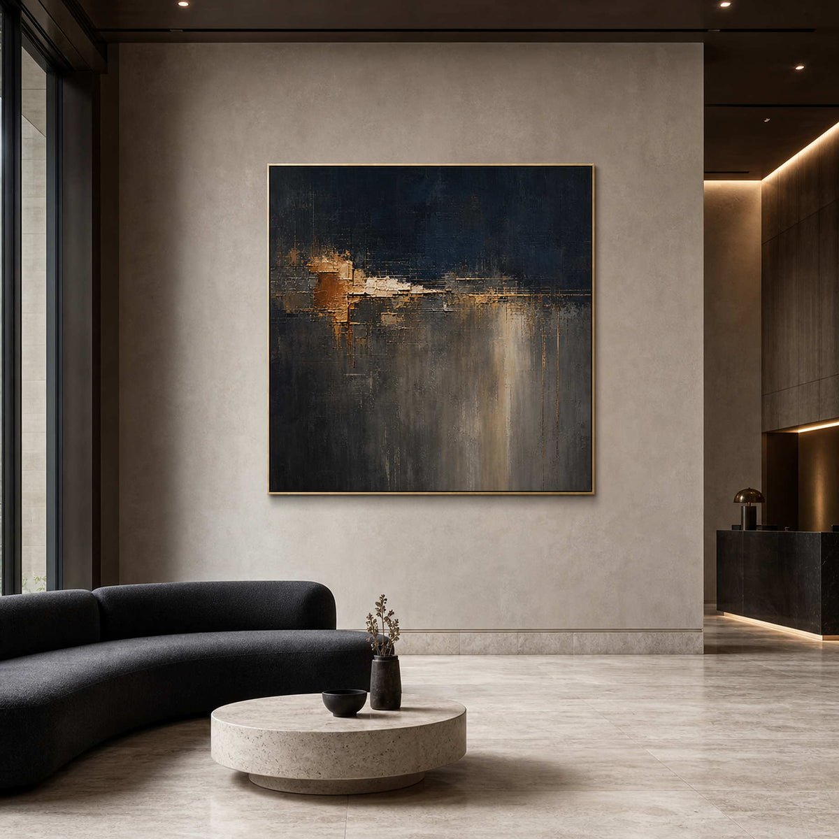 Square dark abstract painting displayed in a contemporary art hotel lobby.
