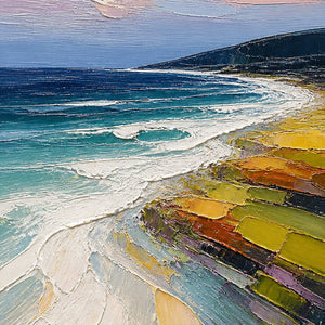Close-up of turquoise surf, dark headland, and colorful shore texture.