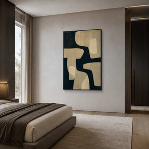 Black and champagne beige wall art displayed in a warm gray bedroom.