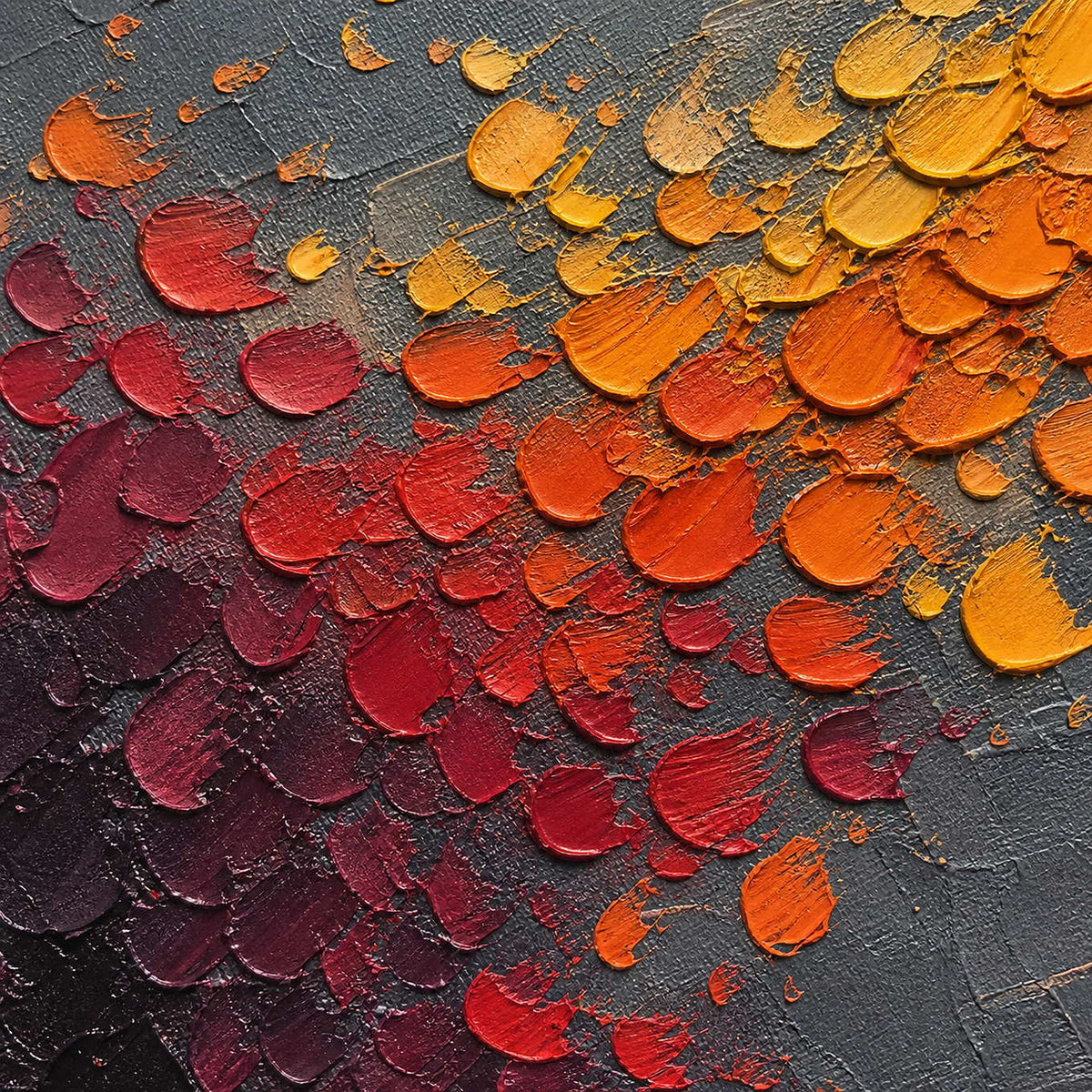 Close-up of raised amber, orange, red, and burgundy palette-knife marks.